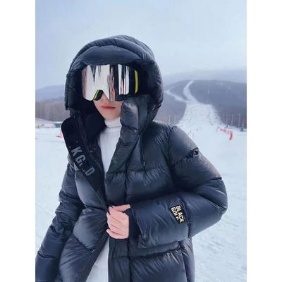 Schwarz Eleganz | Überlange Daunen-Pufferjacke für stilvolle Wärme